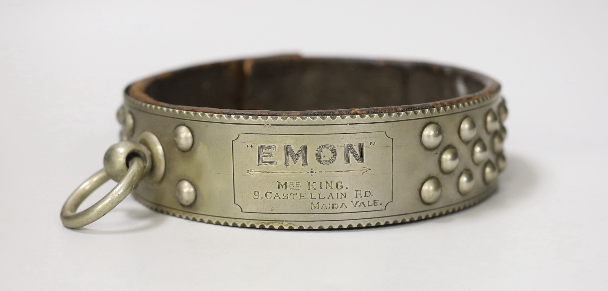 A Victorian nickel studded dog collar engraved 'EMON, MRS KING 9 CASTELLAIN RD. MAIDA VALE', 16.5 cm diameter